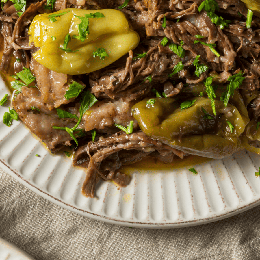 Close up image of Instant Pot Mississippi Pot Roast on a white plate