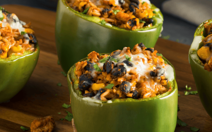 Mexican Stuffed Peppers on a wooden cutting board