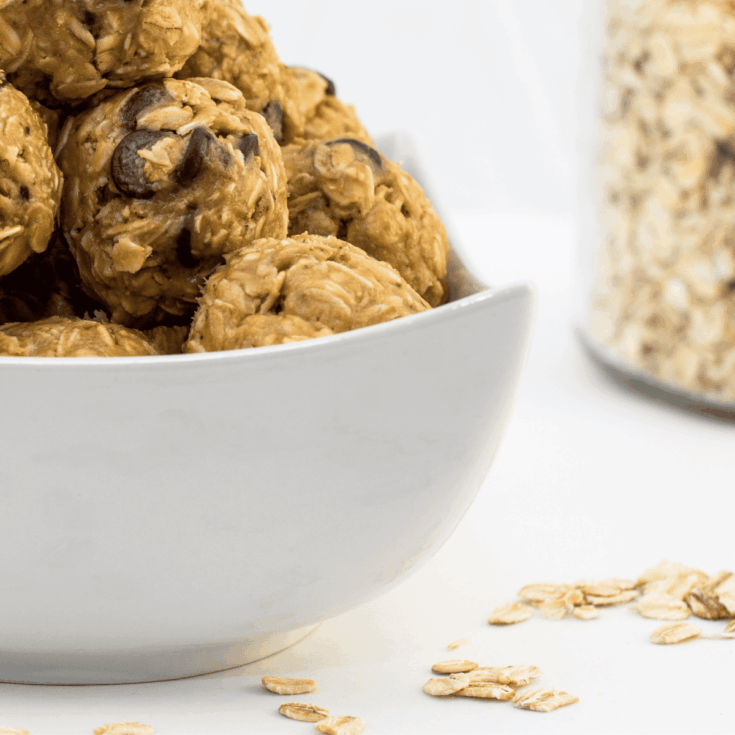 Close up image of peanut butter balls in a white bowl