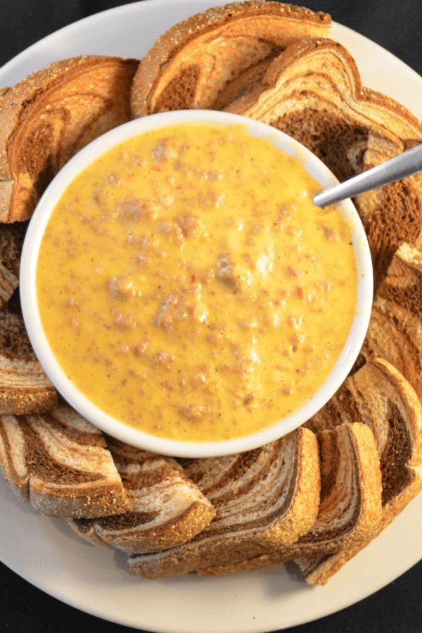 Overhead shot of rotel dip in a bowl surrounded by bread