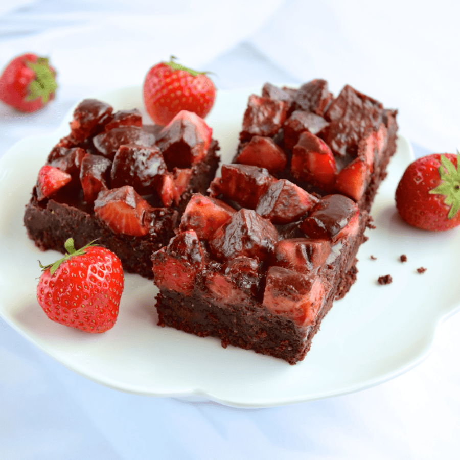 Three Strawberry Brownies on a white plate