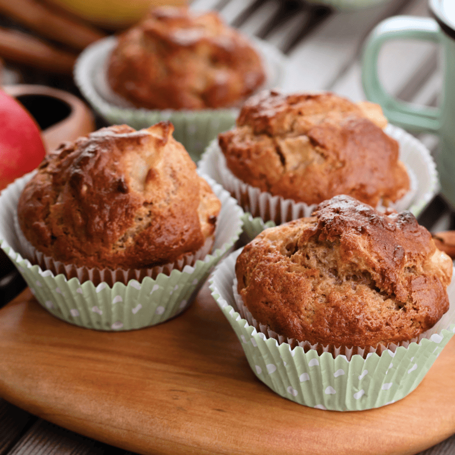 Close up of apple cinnamon muffins on a cutting board
