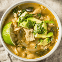 Overhead image of crock pot white chicken chili in a white bowl