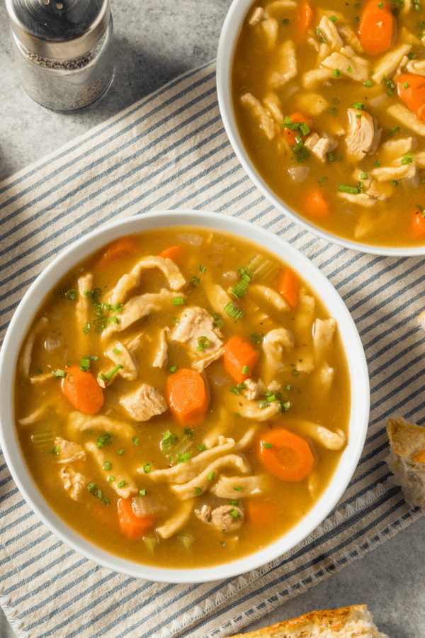 Overhead shot of two bowls of Slow Cooker Chicken Noodle Soup