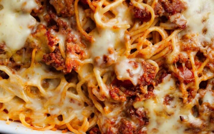 Close up image of baked spaghetti in a baking dish