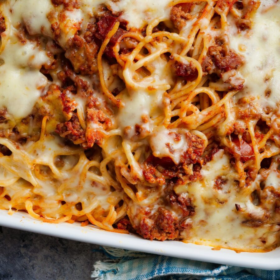 Close up image of baked spaghetti in a baking dish