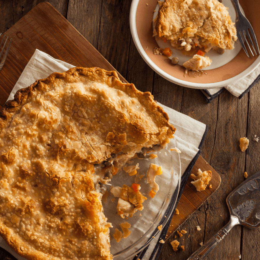 Overhead image of Turkey Pot Pie with a serving cut out of it