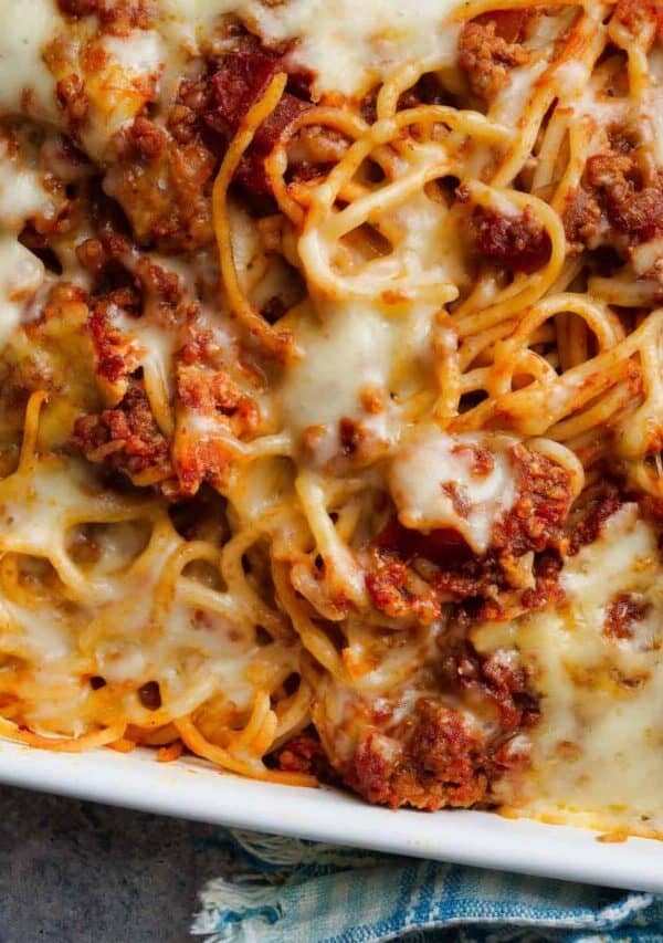 Close up image of baked spaghetti in a baking dish
