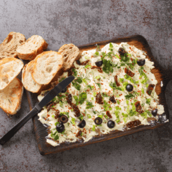 Overhead image of a butter board on a wooden serving platter
