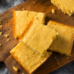 Close up image of Keto Cornbread on a wooden cutting board - 9