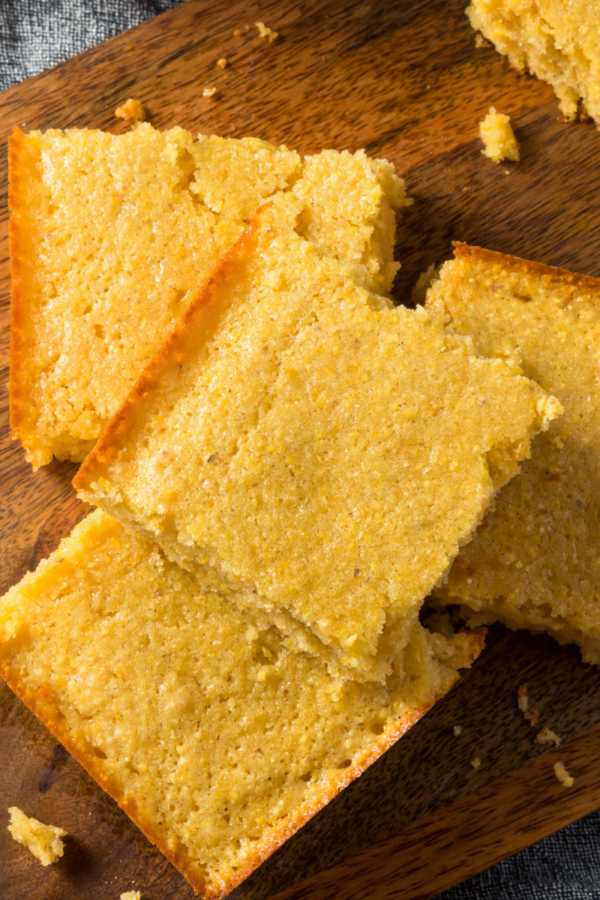 Close up image of Keto Cornbread on a wooden cutting board