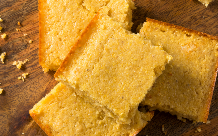 Close up image of Keto Cornbread on a wooden cutting board
