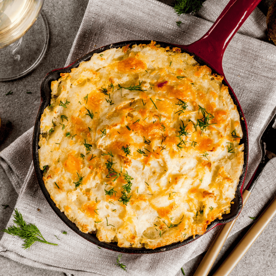 Overhead image of Mashed Potato Casserole in a cast iron skillet