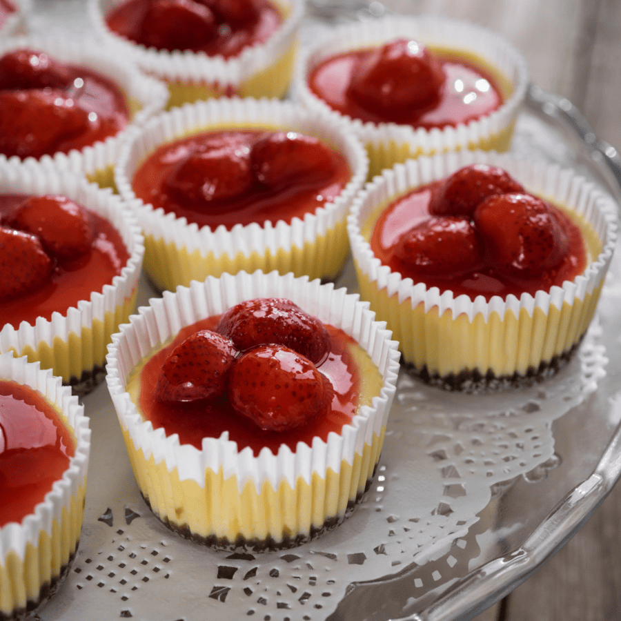 Mini Cheesecakes on a serving tray with a doilie