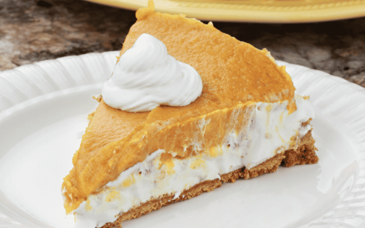 A slice of no bake pumpkin pie on a white plate