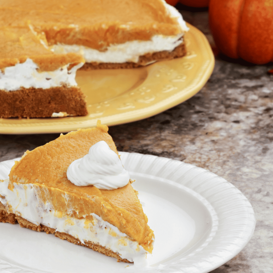 A slice of no bake pumpkin pie in front of the rest of the pie