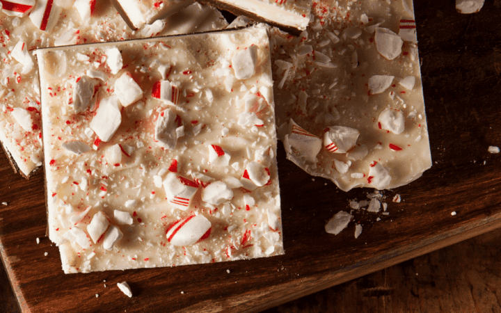 Close up image of Peppermint Bark on a wooden cutting board