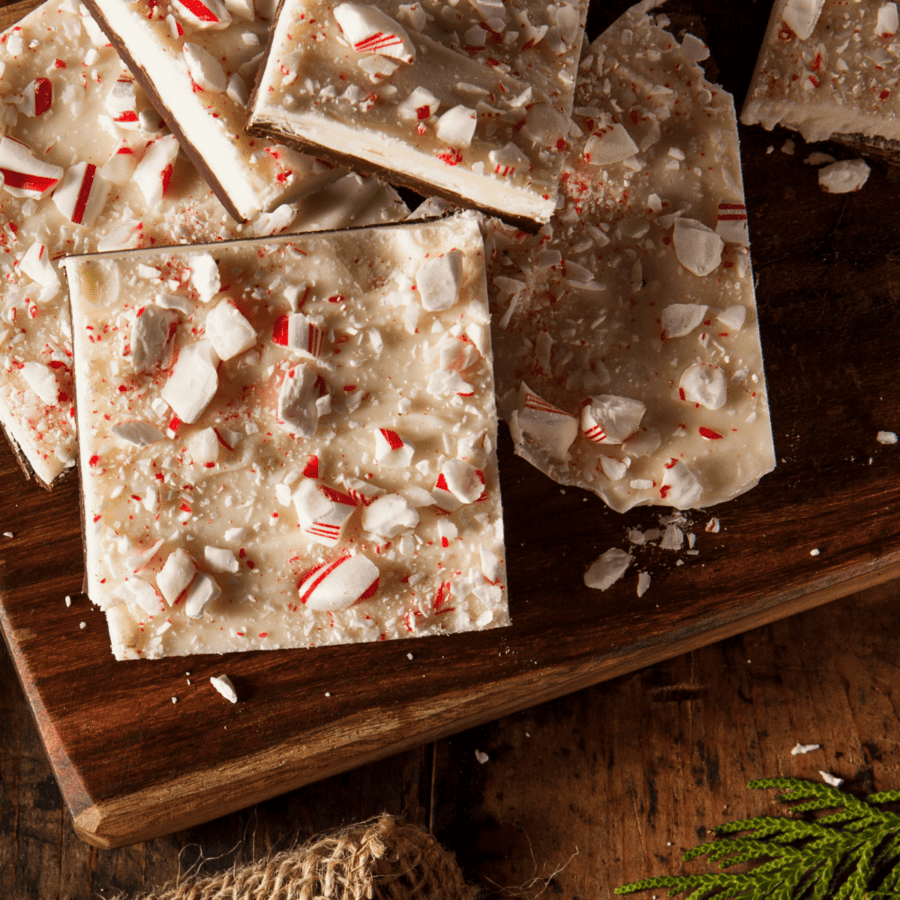 Close up image of Peppermint Bark on a wooden cutting board