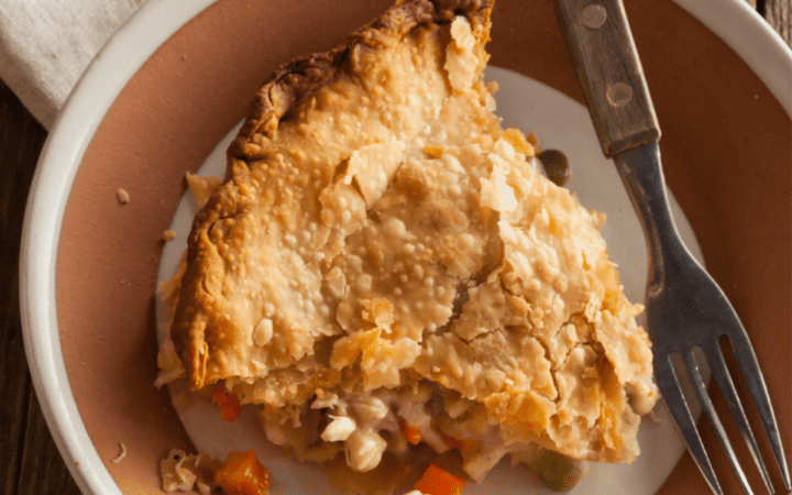 A slice of Turkey Pot Pie in a serving dish