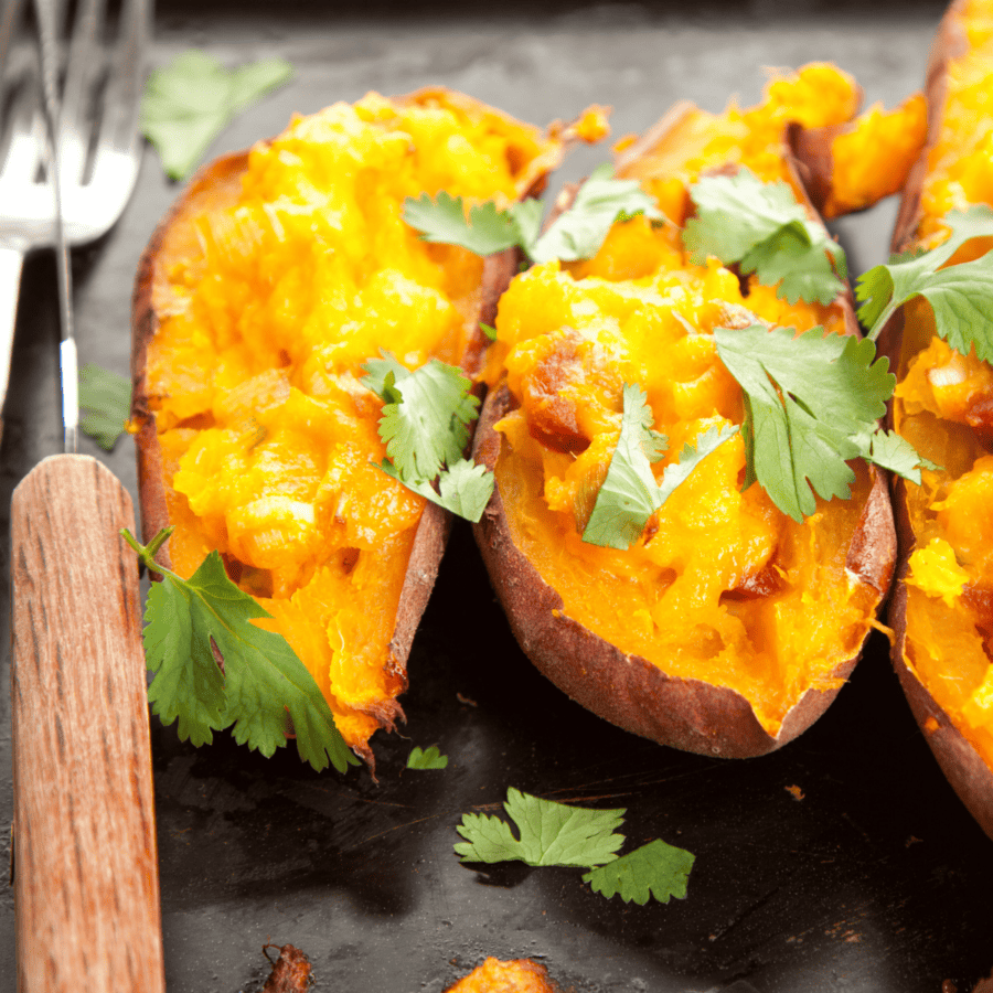 Close up image of Twice Baked Sweet Potatoes with a fork next to them