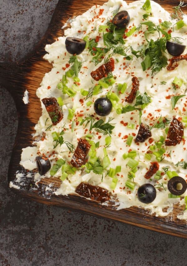 Close up image of a butter board on a wooden surface