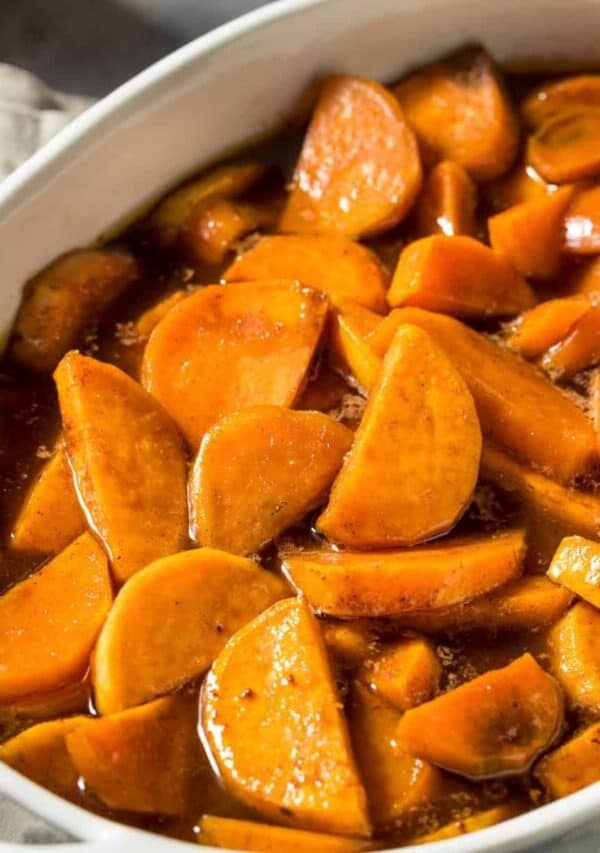 Overhead image of candied yams in a white dish