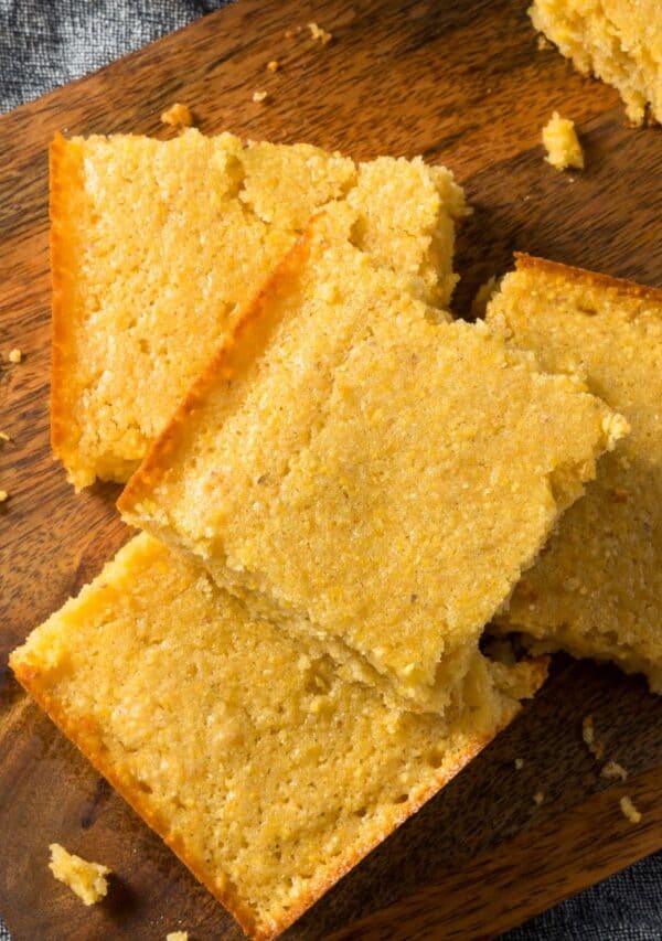 Close up image of Keto Cornbread on a wooden cutting board