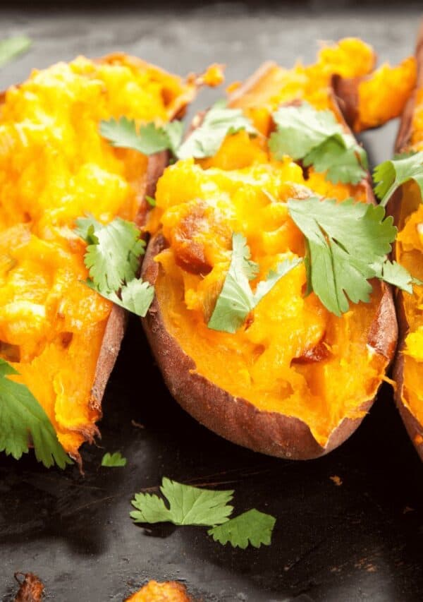 Close up image of Twice Baked Sweet Potatoes with a fork next to them