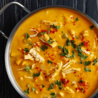 Close up image of Buffalo Chicken Soup in a metal dish