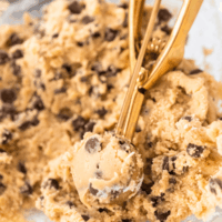 Chickpea Cookie Dough being portioned with a golden scoop