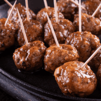 Close up image of Cocktail Meatballs with toothpicks