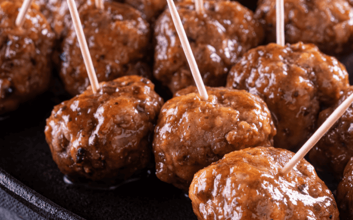 Close up image of Cocktail Meatballs with toothpicks