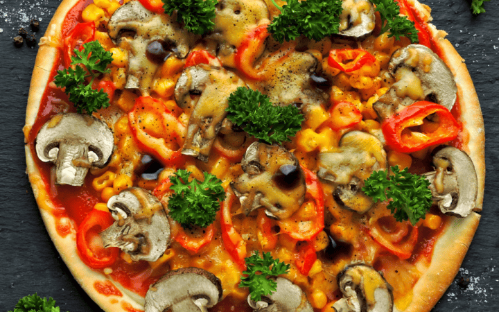 Overhead image of a vegetable pizza prepared on a keto pizza crust