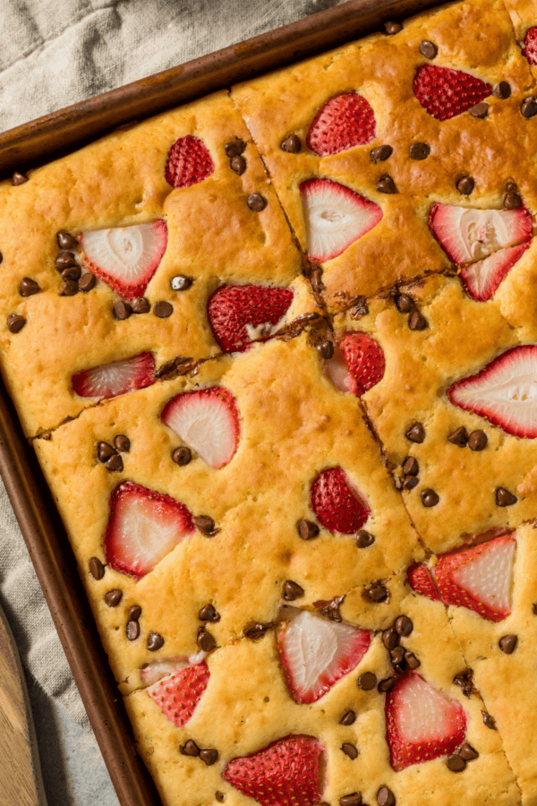 Overhead image of Sheet Pan Pancakes with strawberries and chocolate chips