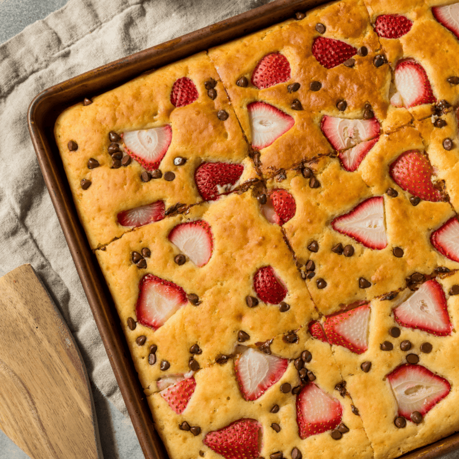 Overhead image of Sheet Pan Pancakes with strawberries and chocolate chips