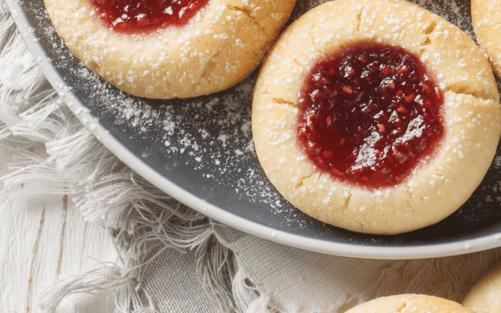 close up image of raspberry thumbprint cookies