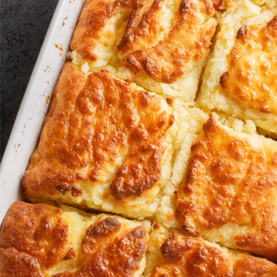 Close up image of Butter Swim Biscuits in a white baking dish