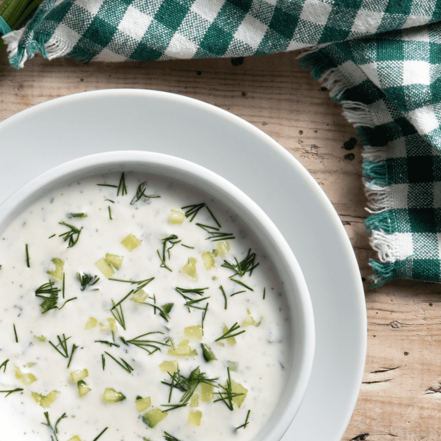 Close up image of Dill Pickle Soup in a white bowl
