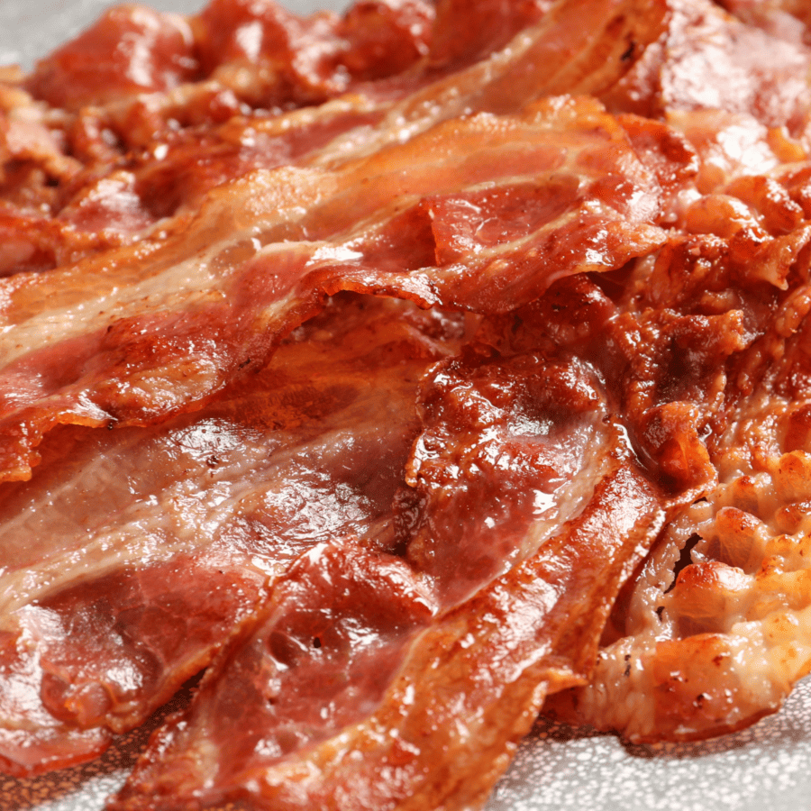 close up image of oven baked bacon on a plate