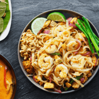 Overhead image of Shrimp Pad Thai in a bowl with garnish