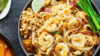 Overhead image of Shrimp Pad Thai in a bowl with garnish
