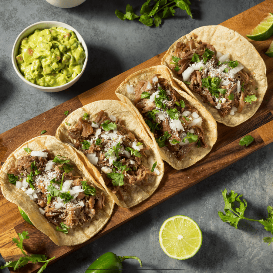 4 Slow Cooker Carnitas on a wooden cutting board