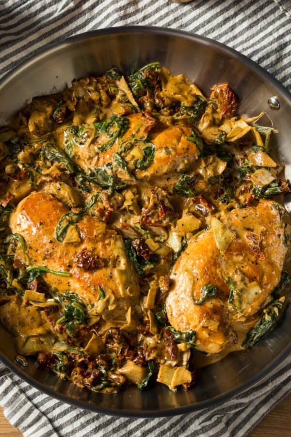 Overhead image of Spinach Artichoke Chicken in a pan