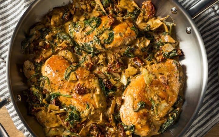 Overhead image of Spinach Artichoke Chicken in a pan
