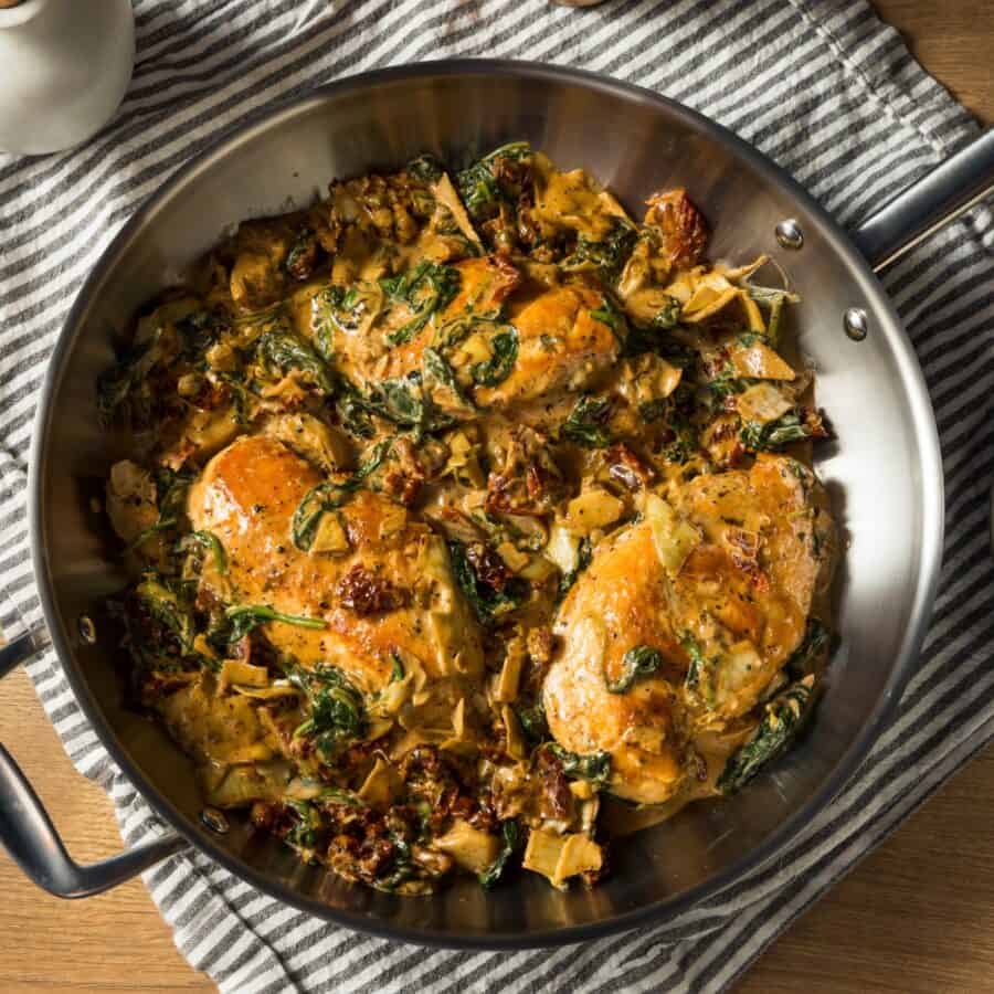 Overhead image of Spinach Artichoke Chicken in a pan