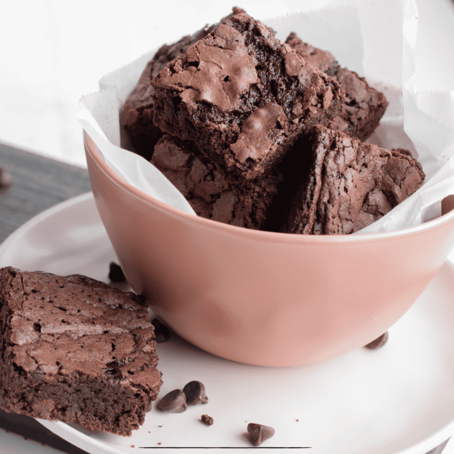 Close up image of Vegan Brownies in a bowl sitting on a saucer