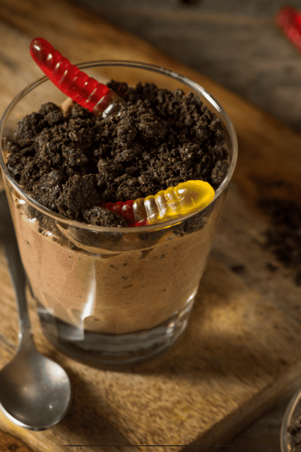 Dirt Cake Cups on a wooden cutting board