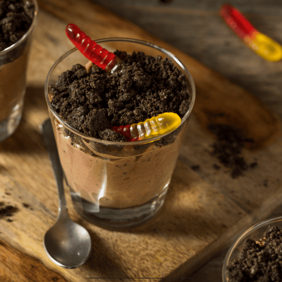 Dirt Cake Cups on a wooden cutting board