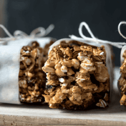 Close up shot of homemade granola bars wrapped with parchment paper