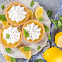Overhead image of Mini Lemon Tarts on a white plate